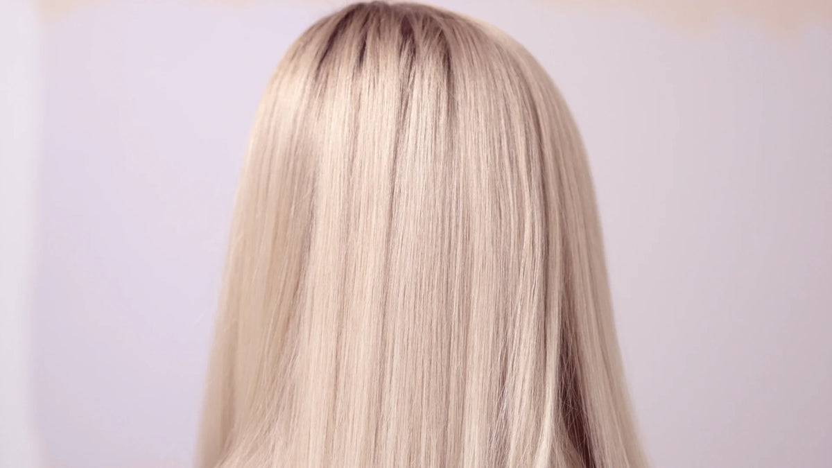 An adult woman seen from behind.