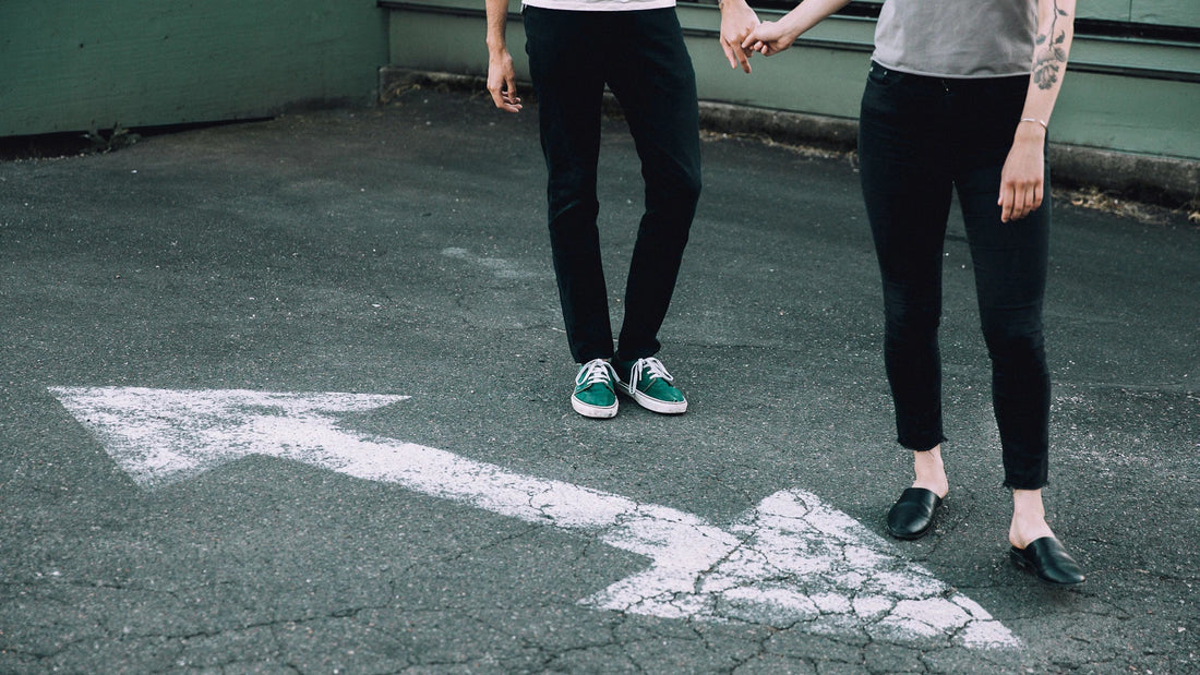 Two people stand together, seen from above.