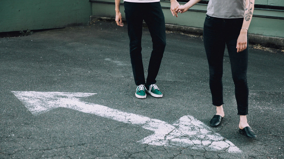 Two people stand together, seen from above.