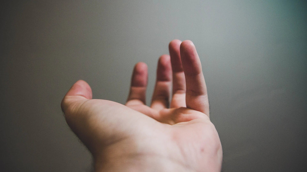 An open hand in natural light, illustrating personal choice and consent.