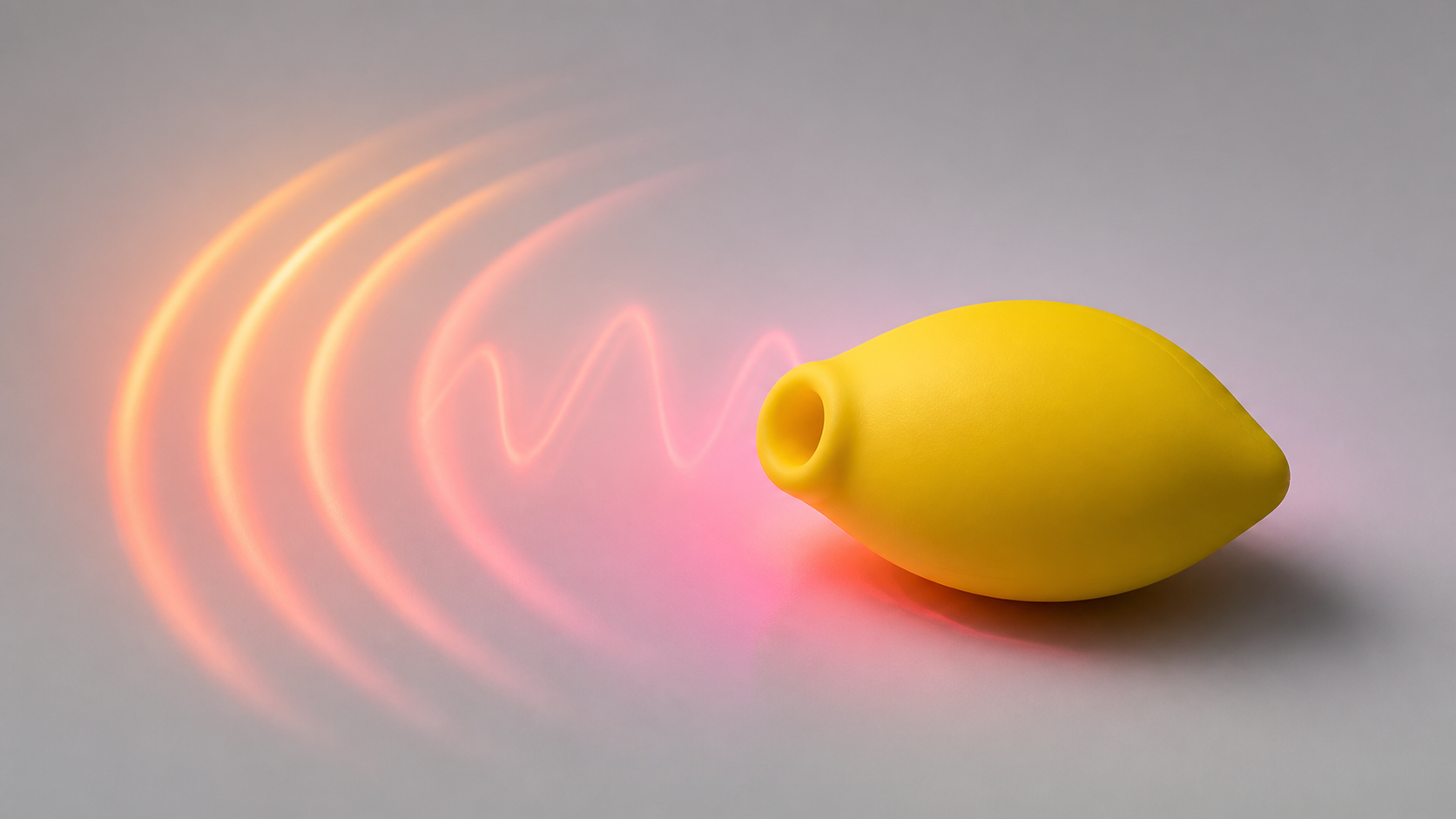 Unbranded yellow external wellness device beside abstract coral and magenta ripple forms representing intensity and rhythm.