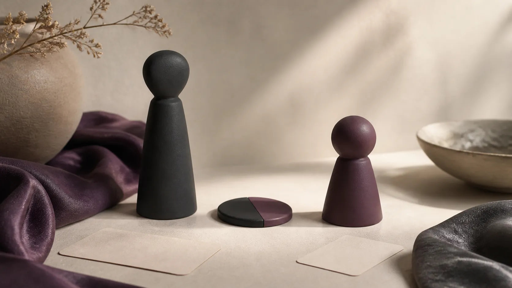 Two abstract figures and a reversible two-color token illustrating flexible adult BDSM roles