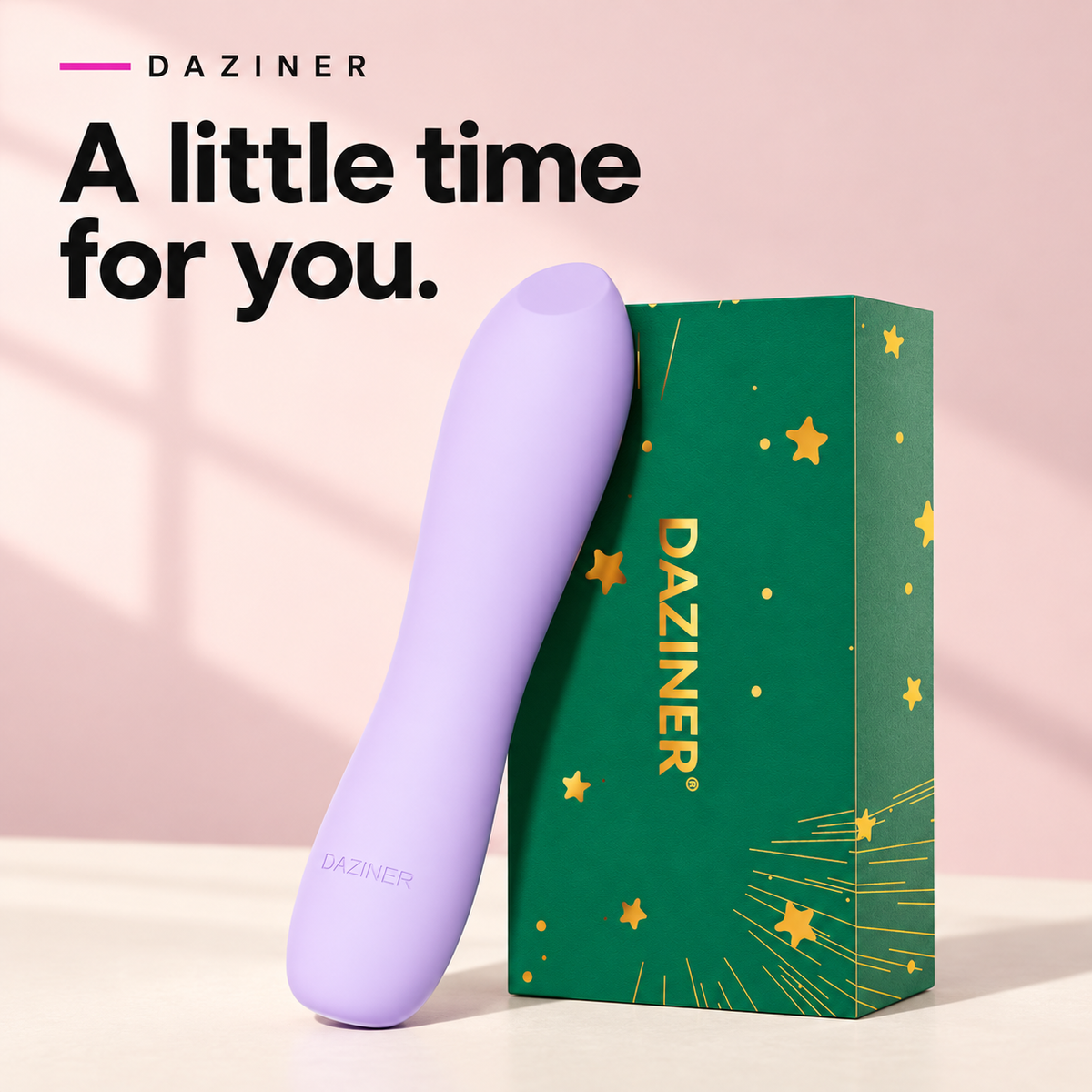 Purple Daziner vibrator beside its green branded packaging