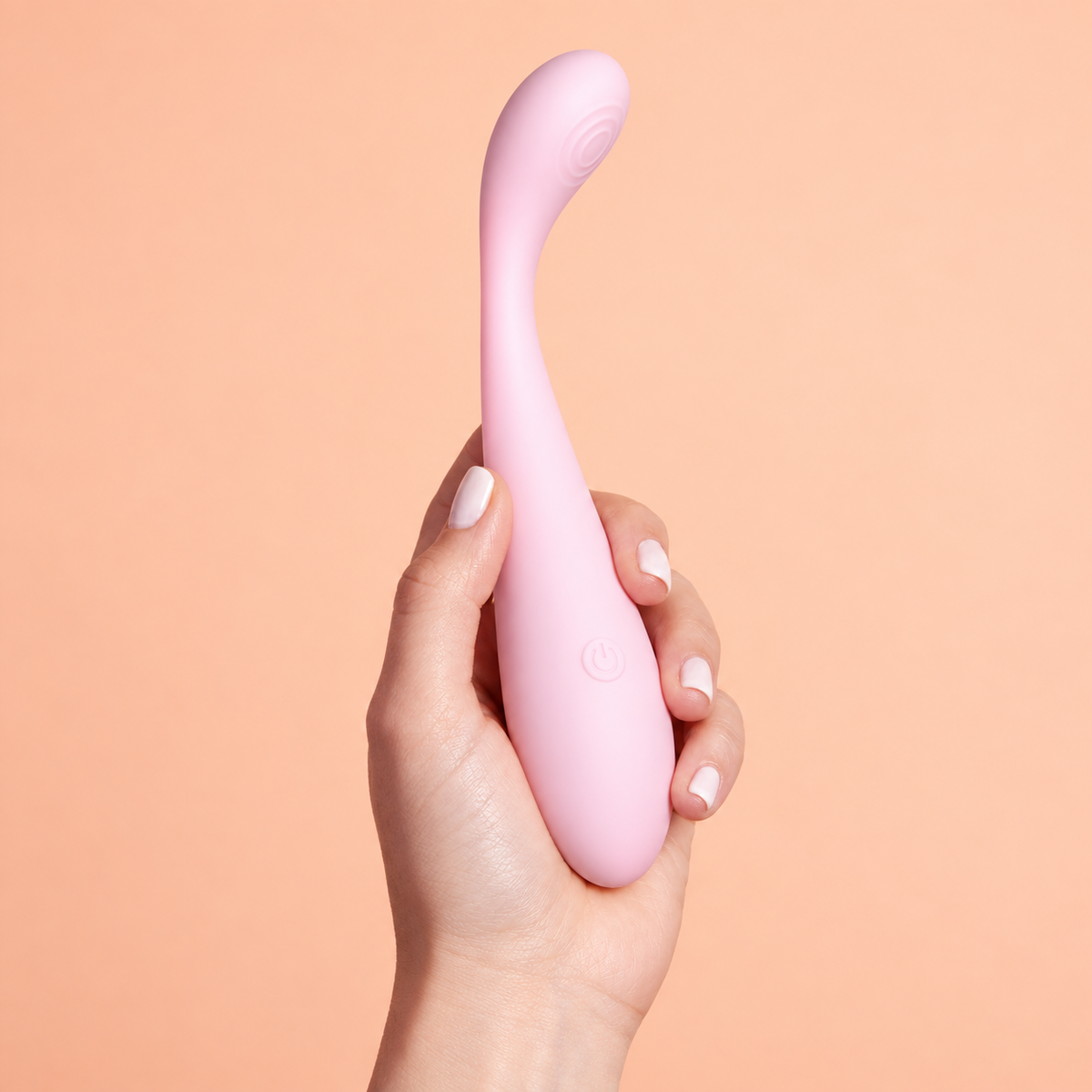 Daziner Crystal WY0714 - adult hand holding the pink vibrator